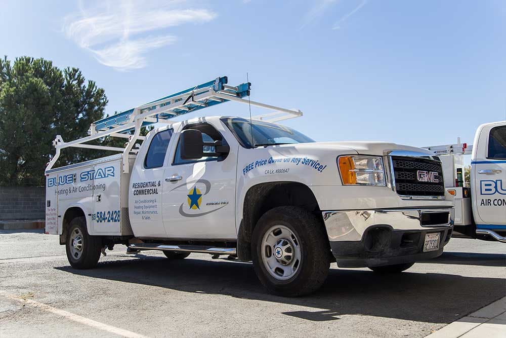 Bruizer, a white Blue Star GMC Sierra 2500HD utility truck with a ladder rack