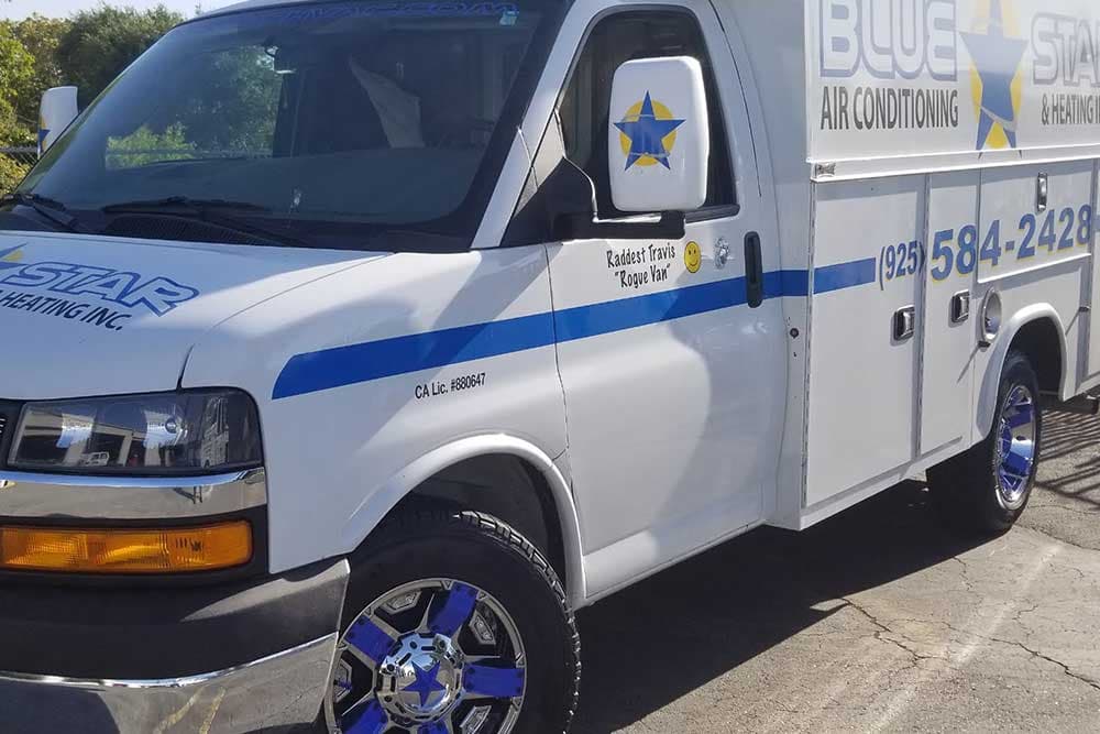 Rogue Van, a white Blue Star cutaway service van with blue-star wheels and 'Raddest Travis Rogue Van' on the door