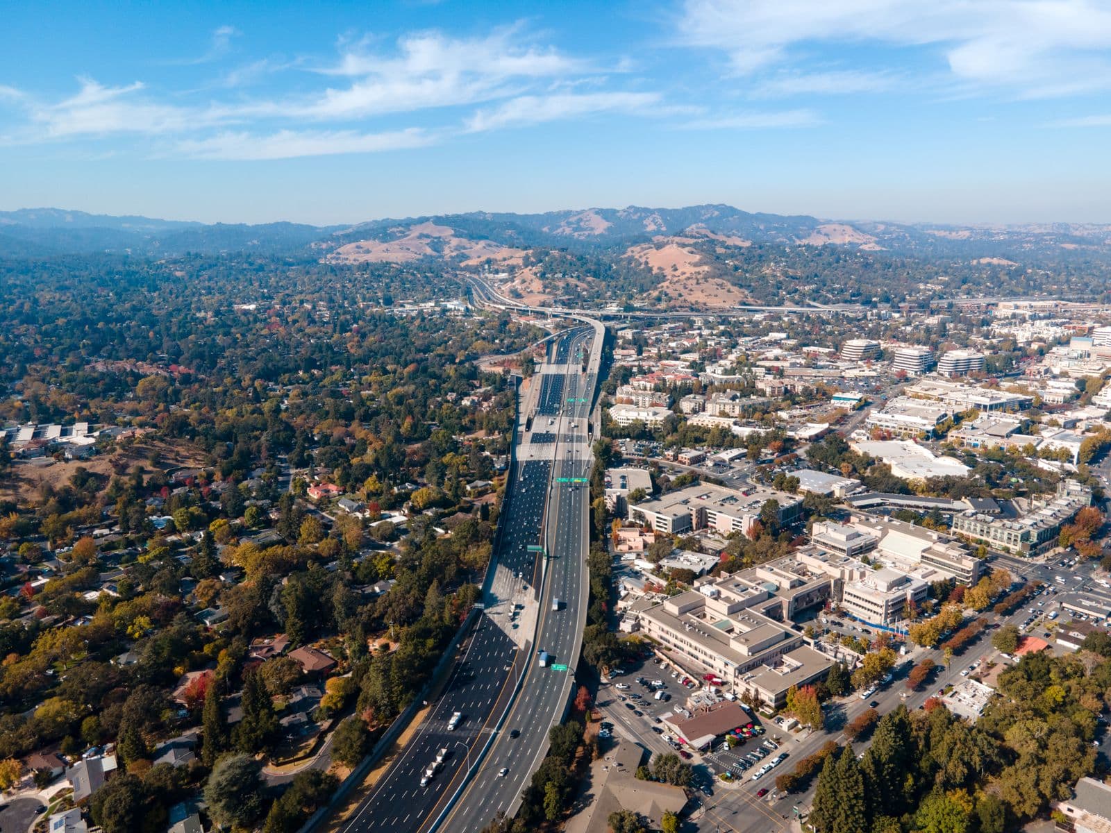 Aerial view of Walnut Creek with Interstate 680, downtown buildings and Mount Diablo on the horizon